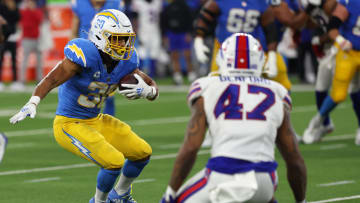 Dec 23, 2023; Inglewood, California, USA;  Los Angeles Chargers running back Austin Ekeler (30) runs against the Buffalo Bills. 