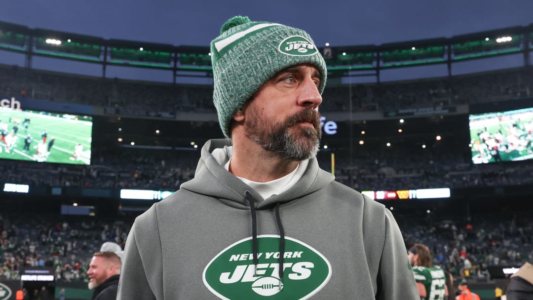 Dec 24, 2023; East Rutherford, New Jersey, USA; New York Jets quarterback Aaron Rodgers (8) on the field after the game against the Washington Commanders at MetLife Stadium. Mandatory Credit: Vincent Carchietta-USA TODAY Sports 